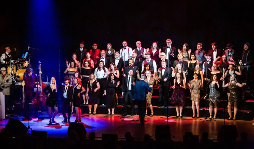 Photo of Revv52 performing at the Bella Concert Hall.
